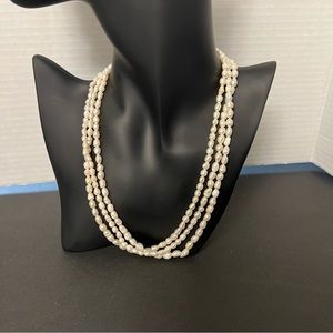 Good pre owned condition three strand faux peals necklace